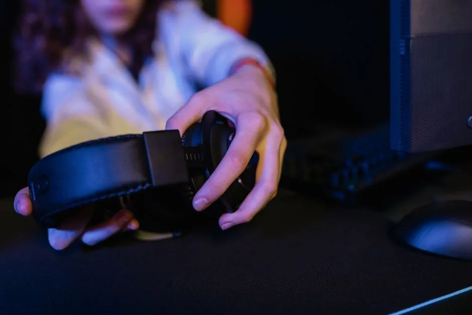 Audeze Maxwell 2 and Razer BlackShark V3 Pro side by side on a desk