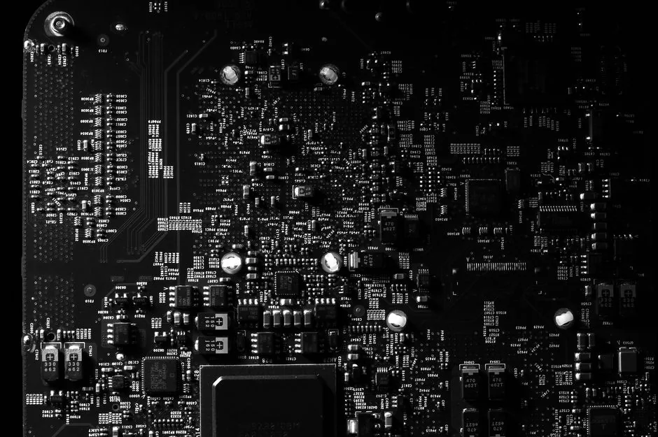a modern amd am5 motherboard with heatsinks and dimm slots