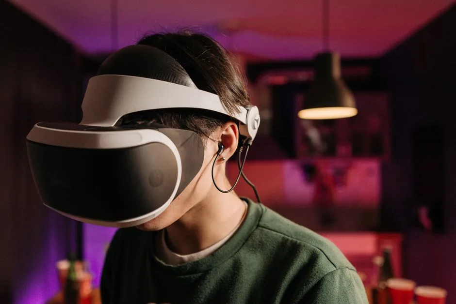 A person wearing a modern headset immersed in a virtual reality experience