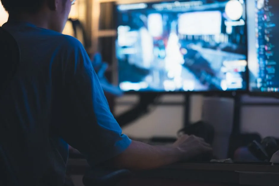 A clean gaming PC workstation desk setup with dual monitors
