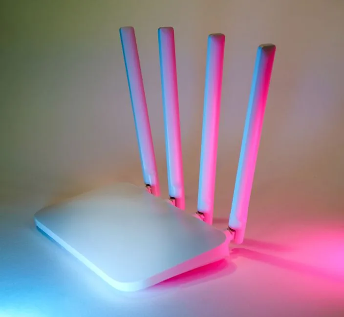 top-down view of a gaming router with neon ambient lighting