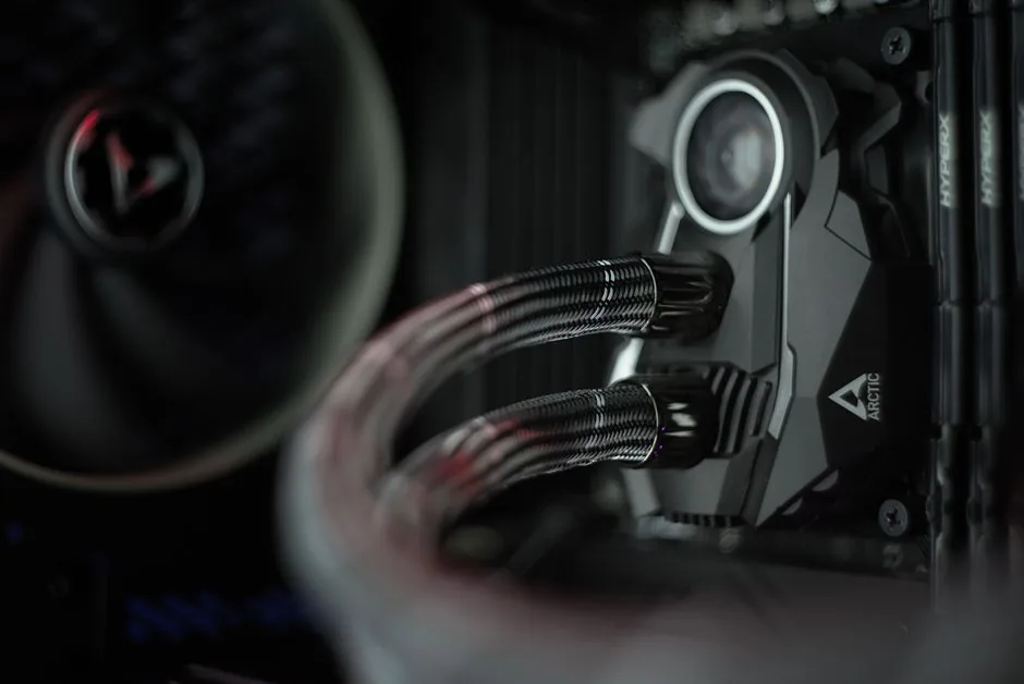 A custom water cooling loop with transparent tubing and RGB coolant in a showcase PC