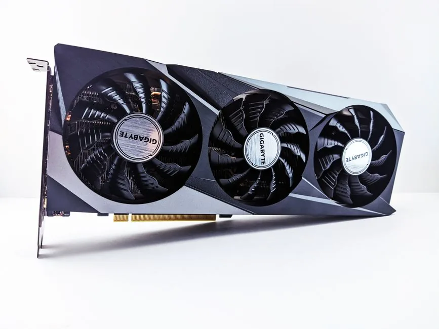 RTX 5070 or 4070 better — dual graphics cards stacked on a wooden surface