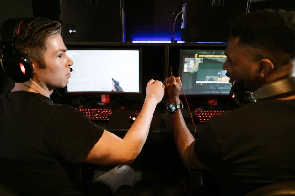 best gaming pc for warzone and streaming at 1440p — dual-monitor desk with a running stream overlay