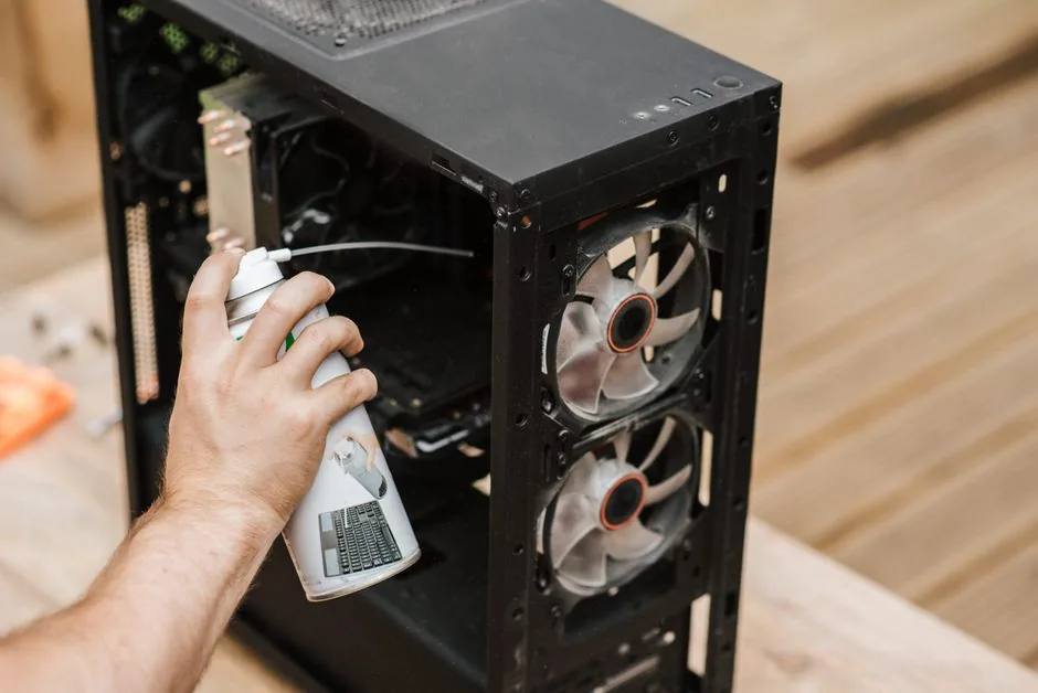 cleaning dust out of a PC with compressed air
