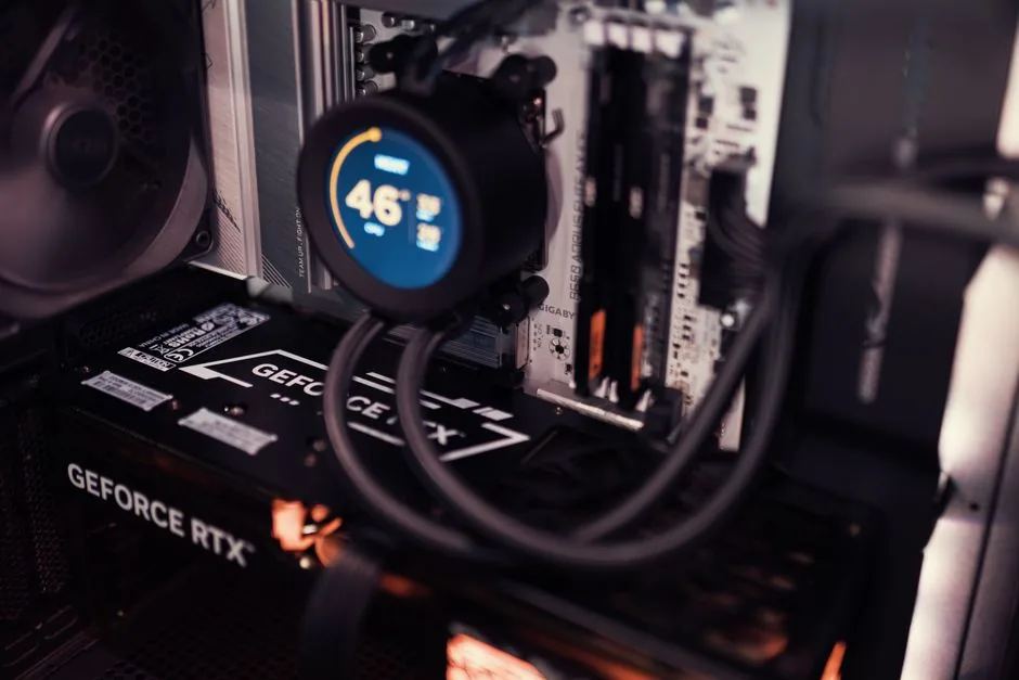 Close-up of a CPU water block and radiator with coolant tubes and RGB lighting
