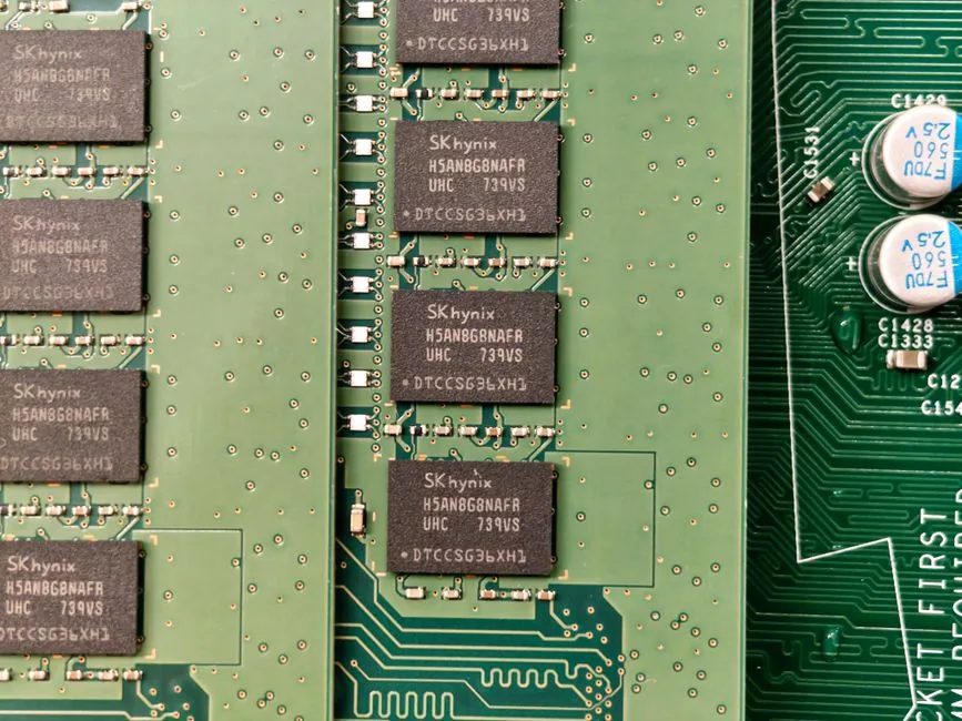close-up of a CPU cooler and GPU installed together on a gaming motherboard