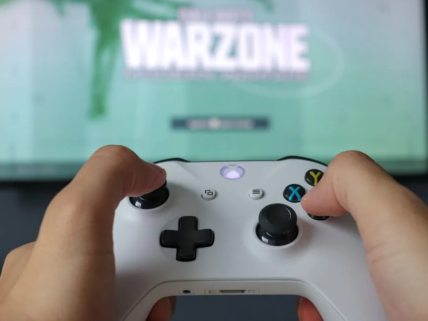 best gaming pc for warzone and streaming — clean cable-managed tower build on a workbench