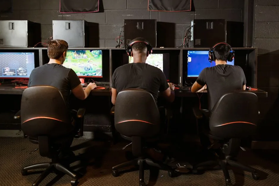 gaming pc for fortnite 240 fps setup — player at a desk with keyboard and 240Hz monitor